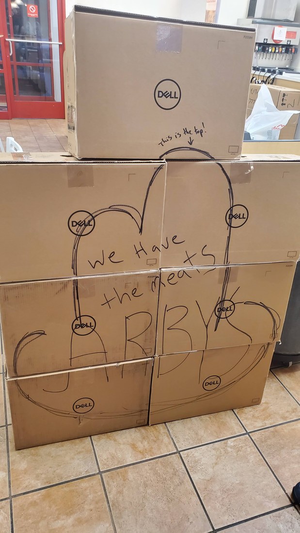 Full Arby's interior view of Dell POS boxes staged for rollout with We Have the Meats written across the boxes