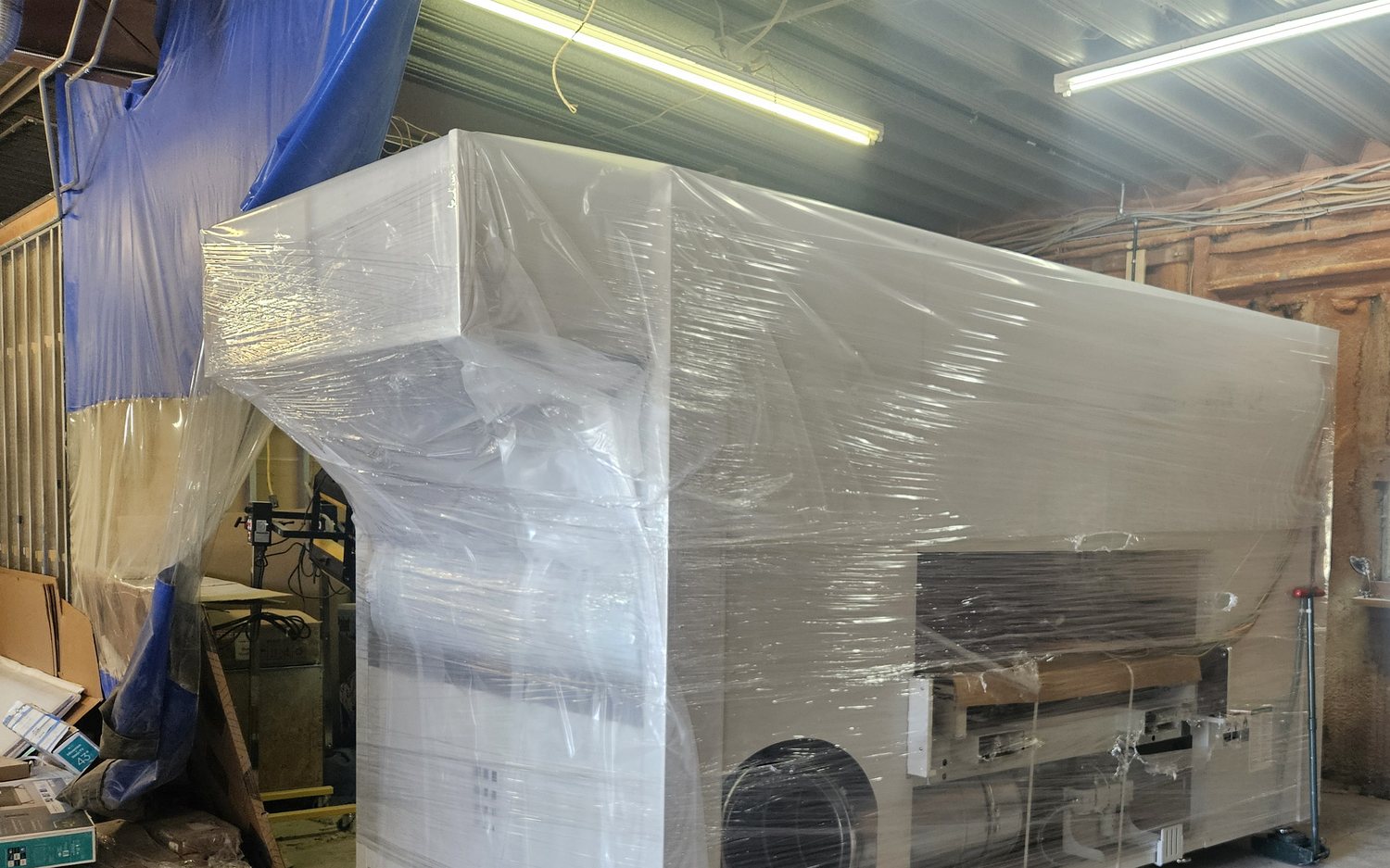 Large wrapped operations equipment in a shop environment